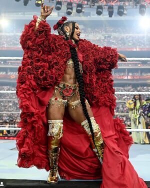 Bianca Crawford Instagram - Gear & Entrance Piece: MADE BY ME
greatEST Gear of ALL TIME
🌹🌹🌹🌹🌹🌹
When I was a little girl my Mama asked me what I wanted to be when I grew up and I said “I want people to throw roses at my feet”.she was confused, but we eventually realized I saw someone on tv performing; receiving a round of applause as people threw roses on stage. Basically, I was saying I wanted to perform. I wanted to entertain. I wanted to pour so much of myself into something that it would make people feel so much and have them jumping to their feet! When you work hard and succeed (success is your own definition) you will get your flowers!

I’ve poured so much of myself into what I do. I love what I do. I’m GREAT at what I do, but that doesn’t mean I don’t get tired, frustrated, overwhelmed, burnt out… I work my ASS off INSIDE AND OUTSIDE the ring because I want to be remembered as someone who earned and deserved EVERYTHING they have gotten, I want to be remembered as someone who entertained you and made you feel something, I want to be remembered as an innovator never duplicator, a trendsetter, and history maker, a one of a kind generational talent that makes a difference in an impactful way and changed the game.
Win or lose I love what I do. Win or lose I’m always proud of the body of work WE do. And win or lose I’ll never let up.

My family has always been my biggest supporters and they have always been with me every step of the way. this #wrESTleMania was special because they were even out there with me.  My step daughter was in my entrance jump roping with her braid. I almost broke hugging her and my parents and husband were with me in my entrance. I was so overwhelmed with time and making my gear. My parents flew down on my bday and we all collectively made this entrance piece. It was a full circle moment of telling my Mama I want people to throw roses at my feet as a kid to now being in WWE and having my mama & daddy toss roses to me & @montezfordwwe as we tag teamed to make this piece. 
I’m walking in my purpose and damn it win or lose cheers or boos “it is what it is”. WE did that yesterday and I’ll be damned if I didn’t get my flowers!
#ESTofWWE
