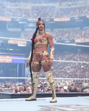Bianca Crawford Instagram - Gear & Entrance Piece: MADE BY ME
greatEST Gear of ALL TIME
🌹🌹🌹🌹🌹🌹
When I was a little girl my Mama asked me what I wanted to be when I grew up and I said “I want people to throw roses at my feet”.she was confused, but we eventually realized I saw someone on tv performing; receiving a round of applause as people threw roses on stage. Basically, I was saying I wanted to perform. I wanted to entertain. I wanted to pour so much of myself into something that it would make people feel so much and have them jumping to their feet! When you work hard and succeed (success is your own definition) you will get your flowers!

I’ve poured so much of myself into what I do. I love what I do. I’m GREAT at what I do, but that doesn’t mean I don’t get tired, frustrated, overwhelmed, burnt out… I work my ASS off INSIDE AND OUTSIDE the ring because I want to be remembered as someone who earned and deserved EVERYTHING they have gotten, I want to be remembered as someone who entertained you and made you feel something, I want to be remembered as an innovator never duplicator, a trendsetter, and history maker, a one of a kind generational talent that makes a difference in an impactful way and changed the game.
Win or lose I love what I do. Win or lose I’m always proud of the body of work WE do. And win or lose I’ll never let up.

My family has always been my biggest supporters and they have always been with me every step of the way. this #wrESTleMania was special because they were even out there with me.  My step daughter was in my entrance jump roping with her braid. I almost broke hugging her and my parents and husband were with me in my entrance. I was so overwhelmed with time and making my gear. My parents flew down on my bday and we all collectively made this entrance piece. It was a full circle moment of telling my Mama I want people to throw roses at my feet as a kid to now being in WWE and having my mama & daddy toss roses to me & @montezfordwwe as we tag teamed to make this piece. 
I’m walking in my purpose and damn it win or lose cheers or boos “it is what it is”. WE did that yesterday and I’ll be damned if I didn’t get my flowers!
#ESTofWWE
