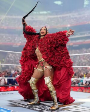Bianca Crawford Instagram - Gear & Entrance Piece: MADE BY ME
greatEST Gear of ALL TIME
🌹🌹🌹🌹🌹🌹
When I was a little girl my Mama asked me what I wanted to be when I grew up and I said “I want people to throw roses at my feet”.she was confused, but we eventually realized I saw someone on tv performing; receiving a round of applause as people threw roses on stage. Basically, I was saying I wanted to perform. I wanted to entertain. I wanted to pour so much of myself into something that it would make people feel so much and have them jumping to their feet! When you work hard and succeed (success is your own definition) you will get your flowers!

I’ve poured so much of myself into what I do. I love what I do. I’m GREAT at what I do, but that doesn’t mean I don’t get tired, frustrated, overwhelmed, burnt out… I work my ASS off INSIDE AND OUTSIDE the ring because I want to be remembered as someone who earned and deserved EVERYTHING they have gotten, I want to be remembered as someone who entertained you and made you feel something, I want to be remembered as an innovator never duplicator, a trendsetter, and history maker, a one of a kind generational talent that makes a difference in an impactful way and changed the game.
Win or lose I love what I do. Win or lose I’m always proud of the body of work WE do. And win or lose I’ll never let up.

My family has always been my biggest supporters and they have always been with me every step of the way. this #wrESTleMania was special because they were even out there with me.  My step daughter was in my entrance jump roping with her braid. I almost broke hugging her and my parents and husband were with me in my entrance. I was so overwhelmed with time and making my gear. My parents flew down on my bday and we all collectively made this entrance piece. It was a full circle moment of telling my Mama I want people to throw roses at my feet as a kid to now being in WWE and having my mama & daddy toss roses to me & @montezfordwwe as we tag teamed to make this piece. 
I’m walking in my purpose and damn it win or lose cheers or boos “it is what it is”. WE did that yesterday and I’ll be damned if I didn’t get my flowers!
#ESTofWWE
