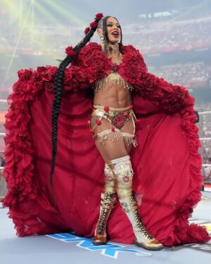Bianca Crawford Instagram - Gear & Entrance Piece: MADE BY ME
greatEST Gear of ALL TIME
🌹🌹🌹🌹🌹🌹
When I was a little girl my Mama asked me what I wanted to be when I grew up and I said “I want people to throw roses at my feet”.she was confused, but we eventually realized I saw someone on tv performing; receiving a round of applause as people threw roses on stage. Basically, I was saying I wanted to perform. I wanted to entertain. I wanted to pour so much of myself into something that it would make people feel so much and have them jumping to their feet! When you work hard and succeed (success is your own definition) you will get your flowers!

I’ve poured so much of myself into what I do. I love what I do. I’m GREAT at what I do, but that doesn’t mean I don’t get tired, frustrated, overwhelmed, burnt out… I work my ASS off INSIDE AND OUTSIDE the ring because I want to be remembered as someone who earned and deserved EVERYTHING they have gotten, I want to be remembered as someone who entertained you and made you feel something, I want to be remembered as an innovator never duplicator, a trendsetter, and history maker, a one of a kind generational talent that makes a difference in an impactful way and changed the game.
Win or lose I love what I do. Win or lose I’m always proud of the body of work WE do. And win or lose I’ll never let up.

My family has always been my biggest supporters and they have always been with me every step of the way. this #wrESTleMania was special because they were even out there with me.  My step daughter was in my entrance jump roping with her braid. I almost broke hugging her and my parents and husband were with me in my entrance. I was so overwhelmed with time and making my gear. My parents flew down on my bday and we all collectively made this entrance piece. It was a full circle moment of telling my Mama I want people to throw roses at my feet as a kid to now being in WWE and having my mama & daddy toss roses to me & @montezfordwwe as we tag teamed to make this piece. 
I’m walking in my purpose and damn it win or lose cheers or boos “it is what it is”. WE did that yesterday and I’ll be damned if I didn’t get my flowers!
#ESTofWWE