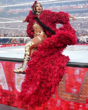 Bianca Crawford Instagram - Gear & Entrance Piece: MADE BY ME
greatEST Gear of ALL TIME
🌹🌹🌹🌹🌹🌹
When I was a little girl my Mama asked me what I wanted to be when I grew up and I said “I want people to throw roses at my feet”.she was confused, but we eventually realized I saw someone on tv performing; receiving a round of applause as people threw roses on stage. Basically, I was saying I wanted to perform. I wanted to entertain. I wanted to pour so much of myself into something that it would make people feel so much and have them jumping to their feet! When you work hard and succeed (success is your own definition) you will get your flowers!

I’ve poured so much of myself into what I do. I love what I do. I’m GREAT at what I do, but that doesn’t mean I don’t get tired, frustrated, overwhelmed, burnt out… I work my ASS off INSIDE AND OUTSIDE the ring because I want to be remembered as someone who earned and deserved EVERYTHING they have gotten, I want to be remembered as someone who entertained you and made you feel something, I want to be remembered as an innovator never duplicator, a trendsetter, and history maker, a one of a kind generational talent that makes a difference in an impactful way and changed the game.
Win or lose I love what I do. Win or lose I’m always proud of the body of work WE do. And win or lose I’ll never let up.

My family has always been my biggest supporters and they have always been with me every step of the way. this #wrESTleMania was special because they were even out there with me.  My step daughter was in my entrance jump roping with her braid. I almost broke hugging her and my parents and husband were with me in my entrance. I was so overwhelmed with time and making my gear. My parents flew down on my bday and we all collectively made this entrance piece. It was a full circle moment of telling my Mama I want people to throw roses at my feet as a kid to now being in WWE and having my mama & daddy toss roses to me & @montezfordwwe as we tag teamed to make this piece. 
I’m walking in my purpose and damn it win or lose cheers or boos “it is what it is”. WE did that yesterday and I’ll be damned if I didn’t get my flowers!
#ESTofWWE