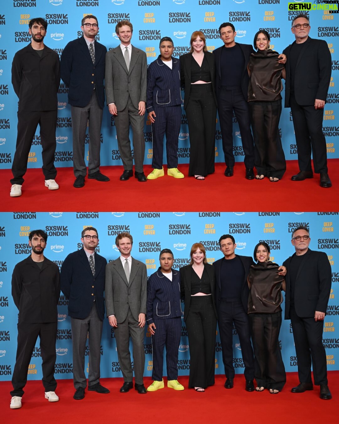Bryce Dallas Howard - 468.8K Likes - Thank you #SXSWLondon for hosting the world premiere of Deep Cover — right in Shoreditch, in the very neighborhood where we filmed, surrounded by the team who brought it to life.

This film is a love letter to improv, to London, and to every cast and crew member who poured their talent and heart into it. 

#DeepCover streams June 12 on @primevideo.

Hair: @halleybrisker
Makeup: @nikki_makeup
Nails: @veenailz

📸 1-2, 7-8: @nikki_makeup
📸 3-5: Getty Images for SXSW London
📸 6: Anthony Harvey/Shutterstock for Amazon Prime Video

[ID: BDH poses for portraits wearing a navy blue @sandroparis sweater with rows of silver buttons on the front on a light blue ruffle collar.  

At the @sxswlondon premiere of Deep Cover, she stands alongside the cast and crew in a black @sandroparis striped three-piece suit with sequins and @stuartweitzman heels. Her hair is straight and falls behind her shoulders. 

And before the premiere, the trio (BDH, Orlando, and Nick) surprise an improv class at the legendary @comedystorelondon and take a photo on the iconic blue-curtained stage. BDH wears a grey @majeparis sweater with a lace collar, @mother jeans, and her silver @rebeccaminkoff pumps.]