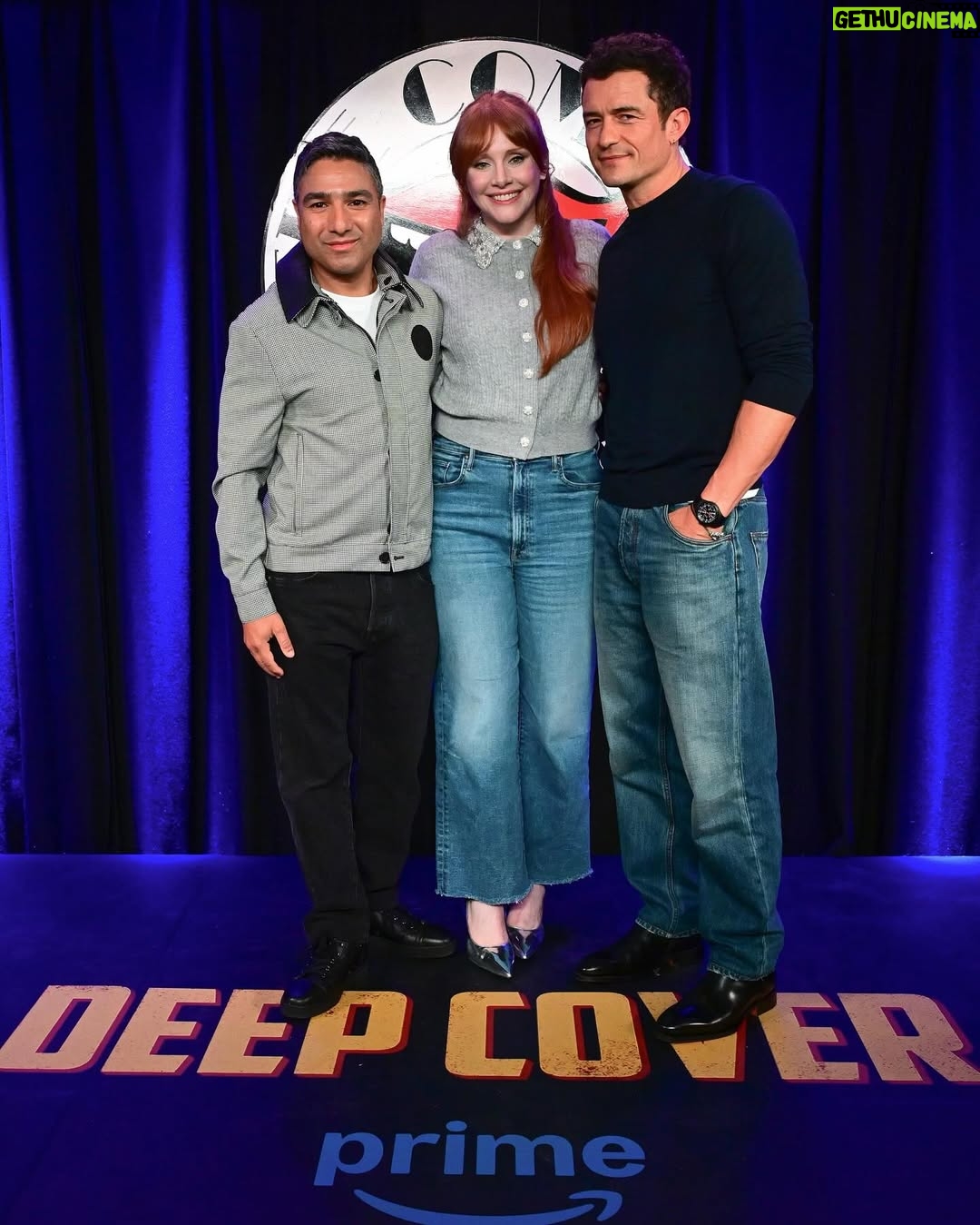 Bryce Dallas Howard - 468.8K Likes - Thank you #SXSWLondon for hosting the world premiere of Deep Cover — right in Shoreditch, in the very neighborhood where we filmed, surrounded by the team who brought it to life.

This film is a love letter to improv, to London, and to every cast and crew member who poured their talent and heart into it. 

#DeepCover streams June 12 on @primevideo.

Hair: @halleybrisker
Makeup: @nikki_makeup
Nails: @veenailz

📸 1-2, 7-8: @nikki_makeup
📸 3-5: Getty Images for SXSW London
📸 6: Anthony Harvey/Shutterstock for Amazon Prime Video

[ID: BDH poses for portraits wearing a navy blue @sandroparis sweater with rows of silver buttons on the front on a light blue ruffle collar.  

At the @sxswlondon premiere of Deep Cover, she stands alongside the cast and crew in a black @sandroparis striped three-piece suit with sequins and @stuartweitzman heels. Her hair is straight and falls behind her shoulders. 

And before the premiere, the trio (BDH, Orlando, and Nick) surprise an improv class at the legendary @comedystorelondon and take a photo on the iconic blue-curtained stage. BDH wears a grey @majeparis sweater with a lace collar, @mother jeans, and her silver @rebeccaminkoff pumps.]