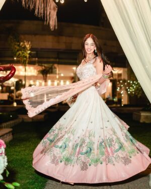 Dhairya Sandhyana Instagram - The feminine urge to twirl every time you wear a lehenga🦚
Outfit: @archanakochharofficial