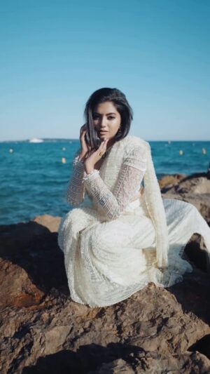Disha Madan Instagram - This is more than just fashion for me, it’s deeply emotional! 💕 #FromKarnatakaToCannes 

Sequins from one of my wedding sarees were delicately lifted and hand-embroidered into this piece, carrying with them memories of one of the most special days of my life. Each shimmer is a fragment of that moment!
To see them reborn in a new silhouette felt surreal, almost sacred! 

The “T”-shaped trail isn’t just dramatic—it’s symbolic. It flows behind me like a quiet reminder of where I’ve come from and the journey I continue to walk.
The blouse adds strength to softness—heavily hand-embellished, with structure that feels powerful yet graceful!

Designer : @shlokasudhakarofficial 
Shot & Edited : @manu_warrier 
HMUA : @makeoverbyyashy