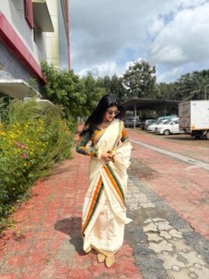 Drishya Raghunath Instagram - Happy onam from DOSE 🫶🏻

Wearing : @abhiramam_ 🌻

#drishya #drishyaraghunath