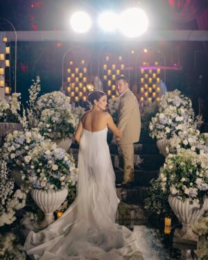 Isabel Oli Instagram - Big thanks to @niceprintphoto for making sure we’ll never forget how much fun this vow renewal was! 📸🎥 Love, laughter, and a whole lot of ‘I do’ all over again. Hello to forever (and lots of great photos to prove it)!!!💍 

#LIVinTheMomentWithJohn 

📍 @nayomiresort 
Tent, Sounds & lights: @ignite.pro 
Food Catering: @juancarlocaterer
📷 @niceprintphoto @charissetinionp 
Event Stylist: @teddymanuel 
Wedding coordinator: @cotevents 
E-invite : @printdivas
Logo: @alwaysinmotionlive

Ceremony Gown: @rosaclaraph 
Party dress: @joesanantonio 
Makeup: @deniseochoa
Hair : @kielotilla 
Rings: @jsdiamondjewellery

John and Freedom’s suit: @the_finegentleman 
Lilly and Lilla’s dress: @audwinlee
Shoes: @jeffersonsi_designs

Smoothie cart: NYMi by @nayomiresort
Fish ball cart: @aysaucefoodcart
Sandwich: @the.croissanterie
Hotdog bun cart: @hotlinksph
Ice cream: @danielbakerph
Coffee cart: @pilgrimscoffee.ph
Charm cart: @the_travelling_charm_bar
Dessert bar: @heavenlydesserts_bychefjeng
Drinks 🍹 : @manilacraft 

Stickers: @WristbandsManiaPH 
Fans: @jisulife.ph
Umbrella: @giftcentral.ph
Tote bags: @heartandsoulphilippines
Candles: @lumicandles.ph
Perfume: @lillaly.ph