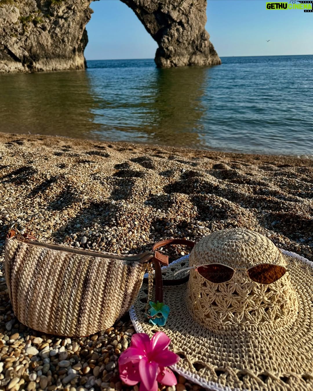Ishita - 11.9K Likes - The only “door” I don’t mind being locked out of—forever ☀️🌊🐚

[durdle door , london , fashion , beach outfits , beach girlie , beach fits , pinterest inspired,fashion girlie ]
