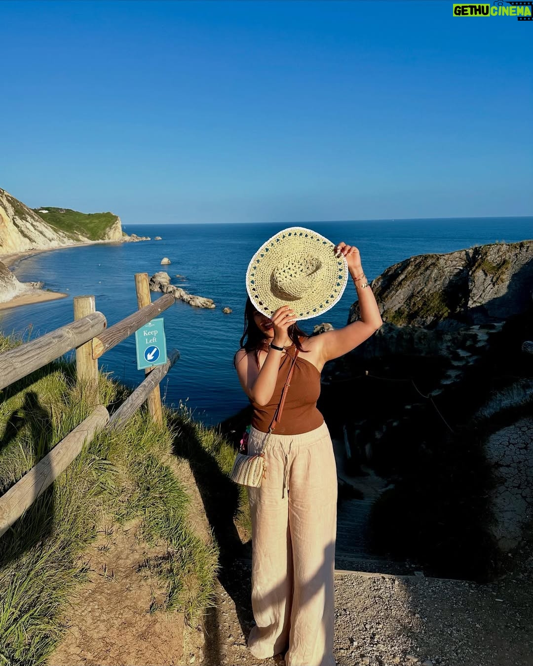 Ishita - 11.9K Likes - The only “door” I don’t mind being locked out of—forever ☀️🌊🐚

[durdle door , london , fashion , beach outfits , beach girlie , beach fits , pinterest inspired,fashion girlie ]