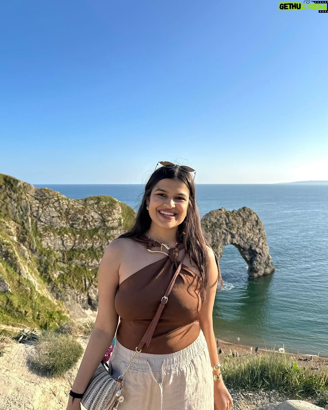 Ishita - 11.9K Likes - The only “door” I don’t mind being locked out of—forever ☀️🌊🐚

[durdle door , london , fashion , beach outfits , beach girlie , beach fits , pinterest inspired,fashion girlie ]