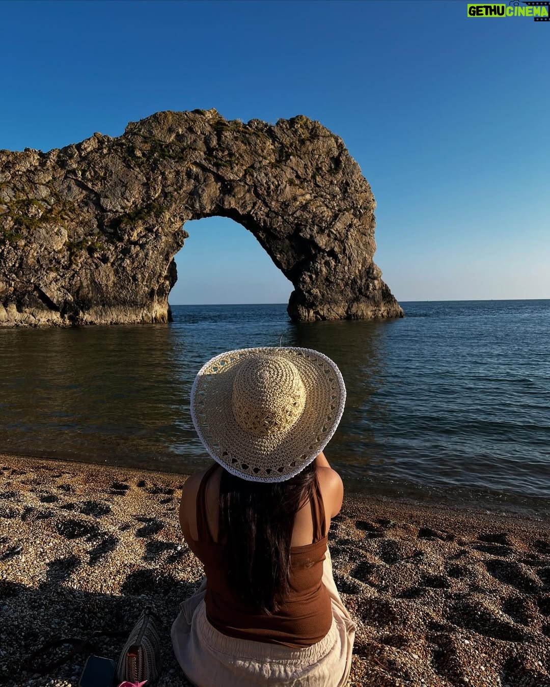 Ishita - 11.9K Likes - The only “door” I don’t mind being locked out of—forever ☀️🌊🐚

[durdle door , london , fashion , beach outfits , beach girlie , beach fits , pinterest inspired,fashion girlie ]