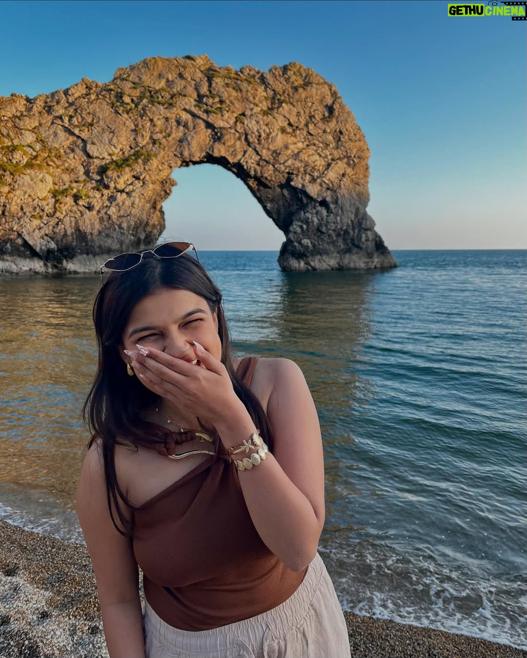 Ishita - 11.9K Likes - The only “door” I don’t mind being locked out of—forever ☀️🌊🐚

[durdle door , london , fashion , beach outfits , beach girlie , beach fits , pinterest inspired,fashion girlie ]