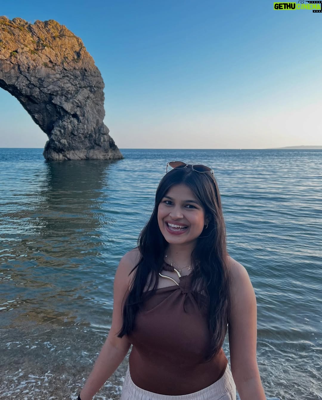Ishita - 11.9K Likes - The only “door” I don’t mind being locked out of—forever ☀️🌊🐚

[durdle door , london , fashion , beach outfits , beach girlie , beach fits , pinterest inspired,fashion girlie ]