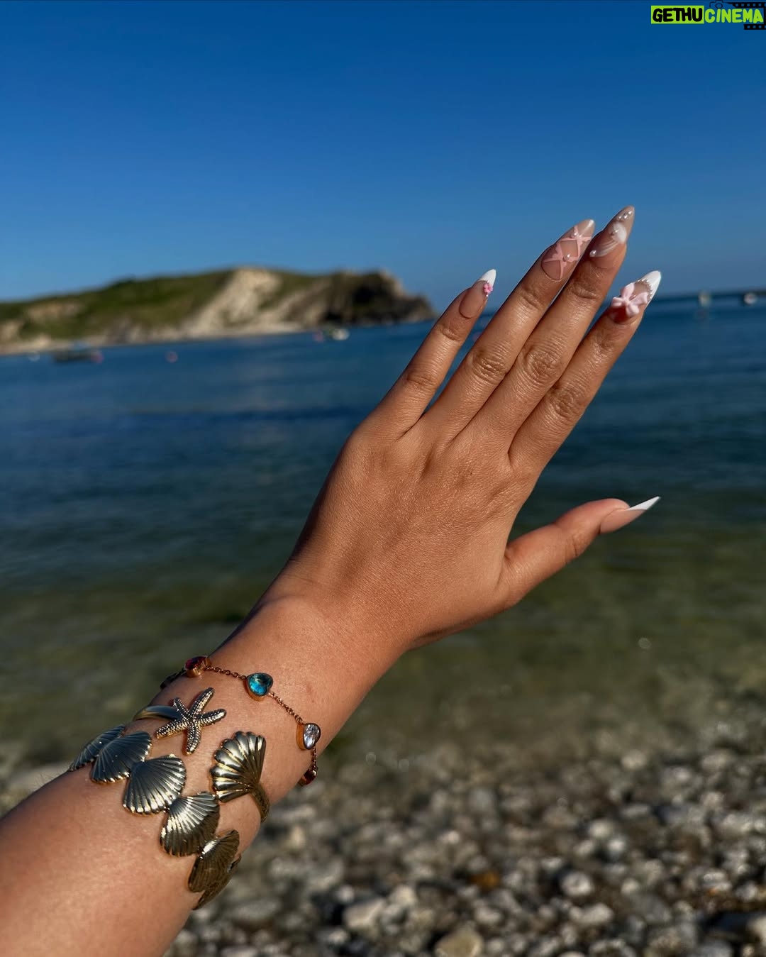 Ishita - 11.9K Likes - The only “door” I don’t mind being locked out of—forever ☀️🌊🐚

[durdle door , london , fashion , beach outfits , beach girlie , beach fits , pinterest inspired,fashion girlie ]