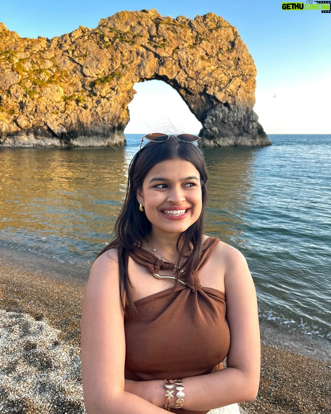 Ishita - 11.9K Likes - The only “door” I don’t mind being locked out of—forever ☀️🌊🐚

[durdle door , london , fashion , beach outfits , beach girlie , beach fits , pinterest inspired,fashion girlie ]