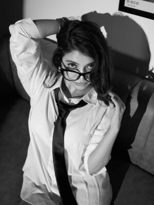 Ishita Anand Instagram - Oversized shirt, tie, boots, attitude- this isn’t your regular 9 to 5 uniform😜
It’s the CREATOR shift: no clock-ins, just camera angles, edits, and ideas turned into outfits🖤🥵

📸 @techjammer 

[oversized shirt outfit, tie styling, black boots fashion, edgy chic look, power dressing with a twist, fashion content creator style, bold confident fits, statement glasses look, outfit inspo India, sassy chic wardrobe, bratz style, bratz style emoji, bratz trend, white shirt, specs look ]