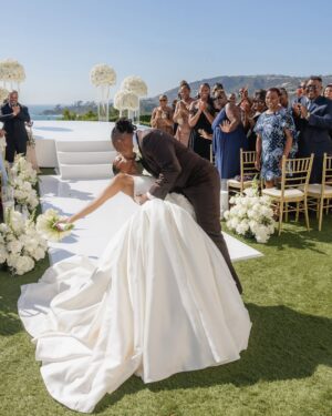 LaToya Tonodeo Instagram - THIS is LOVE 🤎🔒
Thank you @essence 

Thank you Victoria Oluloye for the beautiful article

💍 Intimate   Beautiful. Surrounded by immediate family and a few of our closest friends. We said “I do!”🥂 to our newest chapter of continued LOVE 🤎

Planners: @luckydayeventsco
Venue: @ritzcarltonlagunaniguel
📸 Photography: @pervak_photography 
 📸 Photography: @mr_dadams
Video: @katepervak 
Gown:
@nicolefeliciacouture @jaxonjamescouturebridal
Custom Suit Designer: @OctaviusTerry
Stylist: @fernlegadoe
Jewelry: Razmik & Armen Ghazarians
Custom Wedding band: Joe Bacha
Gown Tailoring: @jilaatelier
Bridal Concierge: @lipstickandjollof 
Brides Shoes:  @jimmychoo 
Makeup: @bryanmendez
Brides Hair: @sosheargenius 
Grooms Hair: @hairstoryhair @sisterlock_consultant_shell 
Barber: @kstheimageconsultant 
Florals: @Flowers_by_margo @thepurplerose.la 
Cake: @Cocoaberrycakeco
Violist: @JeremyxGreen
DJ: @djthirtytwo 
Watercolor Artist: @artmusicmaryjane
Signage: @MadeandTrue