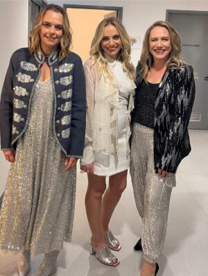 Mia Freedman Instagram - For the last two years, @joeythelabel has dressed us for the @mamamiaoutloud live shows. 
This has meant that @wainwrightholly @jessiestephens90 and I have not had to think about our clothes for a second because we always feel so special and comfortable in our Joey outfits. They just look so good. And she designs for real women’s bodies. 
@joeythelabel is a small, independent Australian business founded by Jo Trotter who is doing it tough after the sudden loss of her sister and has had to take some time from her business. 
As any business owner knows, this is perilous because you don’t get any kind of leave or holidays - the buck stops wtrh you.
So to keep her beloved business afloat Jo is having a big sale. So if you’ve ever thought about buying something from her, now is the time.
I’ve been collecting @joeythelabel pieces for years - and I am proud to own many of her iconic designs. She brings such sparkle and joy to her clothes, I feel so fantastic  every time I put on something Jo has designed. She somehow manages to make classic pieces that are also just so fun and unlike what everyone else does. 
If you can, please support her - and all small businesses founded and run by women - whenever you can. It makes all the difference in the world…. ❤️❤️❤️❤️