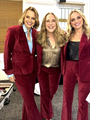 Mia Freedman Instagram - For the last two years, @joeythelabel has dressed us for the @mamamiaoutloud live shows. 
This has meant that @wainwrightholly @jessiestephens90 and I have not had to think about our clothes for a second because we always feel so special and comfortable in our Joey outfits. They just look so good. And she designs for real women’s bodies. 
@joeythelabel is a small, independent Australian business founded by Jo Trotter who is doing it tough after the sudden loss of her sister and has had to take some time from her business. 
As any business owner knows, this is perilous because you don’t get any kind of leave or holidays - the buck stops wtrh you.
So to keep her beloved business afloat Jo is having a big sale. So if you’ve ever thought about buying something from her, now is the time.
I’ve been collecting @joeythelabel pieces for years - and I am proud to own many of her iconic designs. She brings such sparkle and joy to her clothes, I feel so fantastic  every time I put on something Jo has designed. She somehow manages to make classic pieces that are also just so fun and unlike what everyone else does. 
If you can, please support her - and all small businesses founded and run by women - whenever you can. It makes all the difference in the world…. ❤️❤️❤️❤️