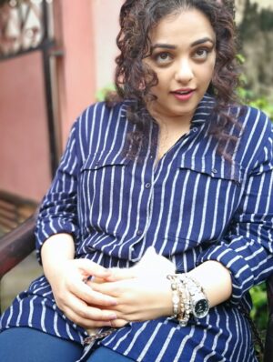 Nithya Menen Instagram - There are some moments (that come rarely) when I feel very nourished by a movie. Simply because it was real cinema… and I could engage the artist in me. I could really do the work that I was always meant to do , but get to do so little of :)
One of those movies is ‘Kolaambi’ directed by @tkrajeevkumar . And it is, to date, one of the few films I’ve done that I know will stand the test of time. Because art lives on and never gets old, and never changes. I still remember well, the day Rajeev sir came to see me in Bangalore at my home to talk to me about this film. It sounded like a real film. Like it had a beating heart. I didn’t need even a moment to think about it. 
And as I expected, I loved working on the film and the people there - The ‘Agrahaaram’ we shot in - where the people would greet us every morning as they went about their everyday routine. We were now just a part of their routine and they would treat us so casually- which I LOVED! No unnecessary intrusion, attention, excitement regarding films or actors or  shooting. What a dream that was- to go about our work normally. We made sure we were as respectful as possible too- keeping silence, eating vegetarian food and keeping the place clean . 
The spunky ‘Paati’ who kept me company while I was waiting in-between shots. She shared her home, her stories and most of all- her AC with us :D
After a week, I found our Line Producer Sujit Soman sitting on her dining table at the far end of her house, eating his meals. They let us do that. They shared everything. 
The river at the end of the road to the Agrahaaram that I would walk up to whenever I had some time . It was a dream to be so close to nature which, truth be told, is the thing I enjoy most. 
And our communal meals in that same restaurant in Fort Cochin! @iamsijoyvarghese @siddharth2121 @r_varman_ and I . We would put all the food in the middle and eat straight off the same bowl. I miss that very much. I felt like myself & I took away something big from it, thanks to Sijoy :)
I hope I have more of this in the days and years to come - these kind of films and these kind of people 🌺
@renji_panicker @rohinimolleti @dileeshpothan @resulpookutty @sabu_cyril