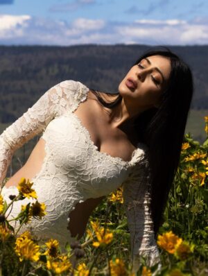 Parvati Melton Instagram - The hills, the blooms, the breeze… all keeping time with the tiny heartbeat I carry… 
Photographer @xnilasx Dress @dollskill 
Follow my new journey 🔜 @nurturedbyparvati 🧿🪬🙏