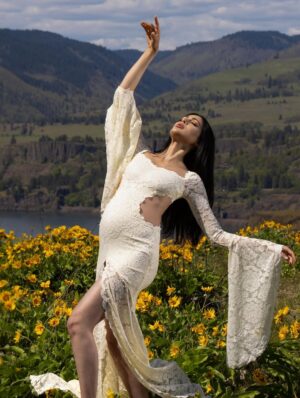 Parvati Melton Instagram - The hills, the blooms, the breeze… all keeping time with the tiny heartbeat I carry… 
Photographer @xnilasx Dress @dollskill 
Follow my new journey 🔜 @nurturedbyparvati 🧿🪬🙏