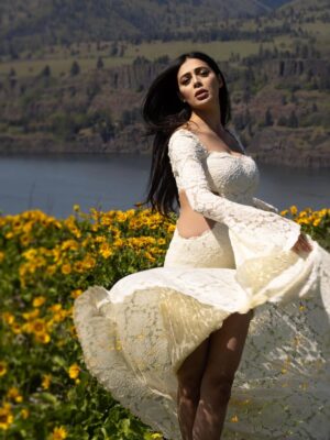 Parvati Melton Instagram - The hills, the blooms, the breeze… all keeping time with the tiny heartbeat I carry… 
Photographer @xnilasx Dress @dollskill 
Follow my new journey 🔜 @nurturedbyparvati 🧿🪬🙏