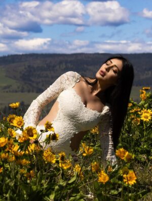 Parvati Melton Instagram - The hills, the blooms, the breeze… all keeping time with the tiny heartbeat I carry… 
Photographer @xnilasx Dress @dollskill 
Follow my new journey 🔜 @nurturedbyparvati 🧿🪬🙏