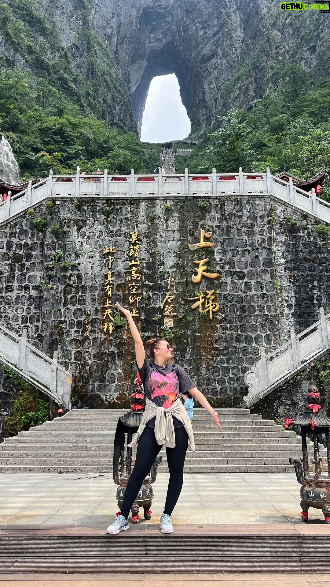 Pooja Chen - 2.1K Likes - Between sky and earth, there lies a gate. 
I walked to it, one step at a time. 
999 steps later, I’m spiritually enlightened and physically destroyed.

📍 Zhangjajie, China

[ Stairway to heaven, Tianmen mountain, Heaven’s gate, Zhangjajie, China Travel, Hidden gems, Nature ]