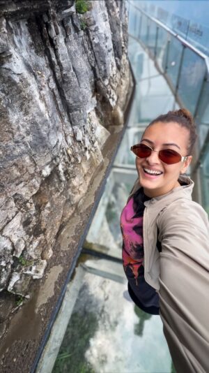Pooja Chen Instagram - Just casually strolling on the cliff’s crystal edge 🪞⛰️

Balanced high above the clouds on the Zhangjiajie Tianmen Mountain’s West line route, there is a glass walkway — a heart-racing stroll with sheer drops and breathtaking views all around.

[ Zhangjiajie, China travels, Tianmen mountain, cliff walk, glass bridge, adventure travel, heart racing walkway ]
