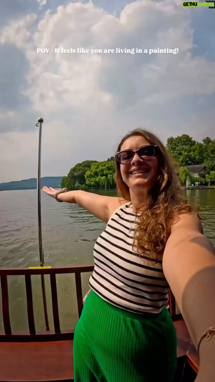 Pooja Chen - 497 Likes - Like that old picture we’d always draw as kids - the lake so still, mountains hazy blue, trees green as crayons could make them, and little boats drifting like they belonged to the moment. 
Well I lived that painting!
📍 Hangzhou West Lake

[ Hangzhou, Travel, Lake, Aesthetic Travel, Travel Vlog, Beautiful Destinations, Unique Places ]