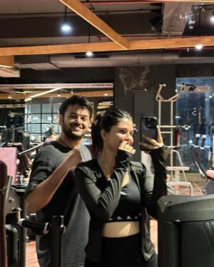 Rupal Yadav Instagram - This past year had its ups and downs but if there’s one thing I’m grateful for - it’s that we had each other through it all♥️
📸 *Slide 1:* The day I had my YouTube Accelerator event, and he showed up just to cheer me up before my speech🥹💖
📸 *Slide 2:* Beyond the workouts I think we bonded the most on our way to the gym..endless random convos, hyping each other up & just being our unfiltered selves🫶🏻
📸 *Slide 3:* Our first live stand-up show in Gurgaon that took us forever to reach😂
📸 *Slide 4:* Our first international trip together to Bali, where we had the most fun and learned so much about each other❤️
📸 *Slide 5:* The time I had just moved to Noida, and he randomly showed up - no plans, no reason, just to be there🥹
📸 *Slide 6:* Just after our roka!💍✨We were so happy that finally our families met and everything just felt perfect❤️ That “it’s really happening” feeling hit us hard & we couldn’t stop smiling the whole time!
📸 *Slide 7:* Just a random picture but one of our favourite things we do together - our long walks❤️batein karte karte kab 15,000 steps ho jaate hain pata hi nahi chalta!!🥹
📸 *Slide 8:* The first time Rajat gave me flowers… and that too in full filmy style! Kabhi fursat se poori story bataungi😛
📸 *Slide 9:* Bali again—where we got matching tattoos! Rajat’s first-ever tattoo, and he was so happy with it☺️
📸 *Slide 10:* Our crazy ATV ride in Bali! Even now, thinking about that day makes us smile☺️💗 Traveling with him is a whole different vibe! ❤️
📸 *Slide 11:* Gili T Island—some of our best memories together. Can’t wait to go back someday🌊✨
📸 *Slide 12:* One of our many flights! Honestly, we’ve taken so many secret trips this past year, I’ve lost track. ✈️😂 Here’s to many more! ❤️
📸 *Slide 13:* The day of our roka—the moment it *really* hit us… shit, this is actually happening! 💍🥹
📸 *Slide 14:* The day we officially got engaged! Still feels unreal. 💖✨
📸 *Slide 15:* Came to see him, and before leaving, idk why I wrote on his mirror with my lipstick. Ewwww cringeeeeeee ik
Here’s to many more memories together!🥹❤️🧿
Love you R❤️