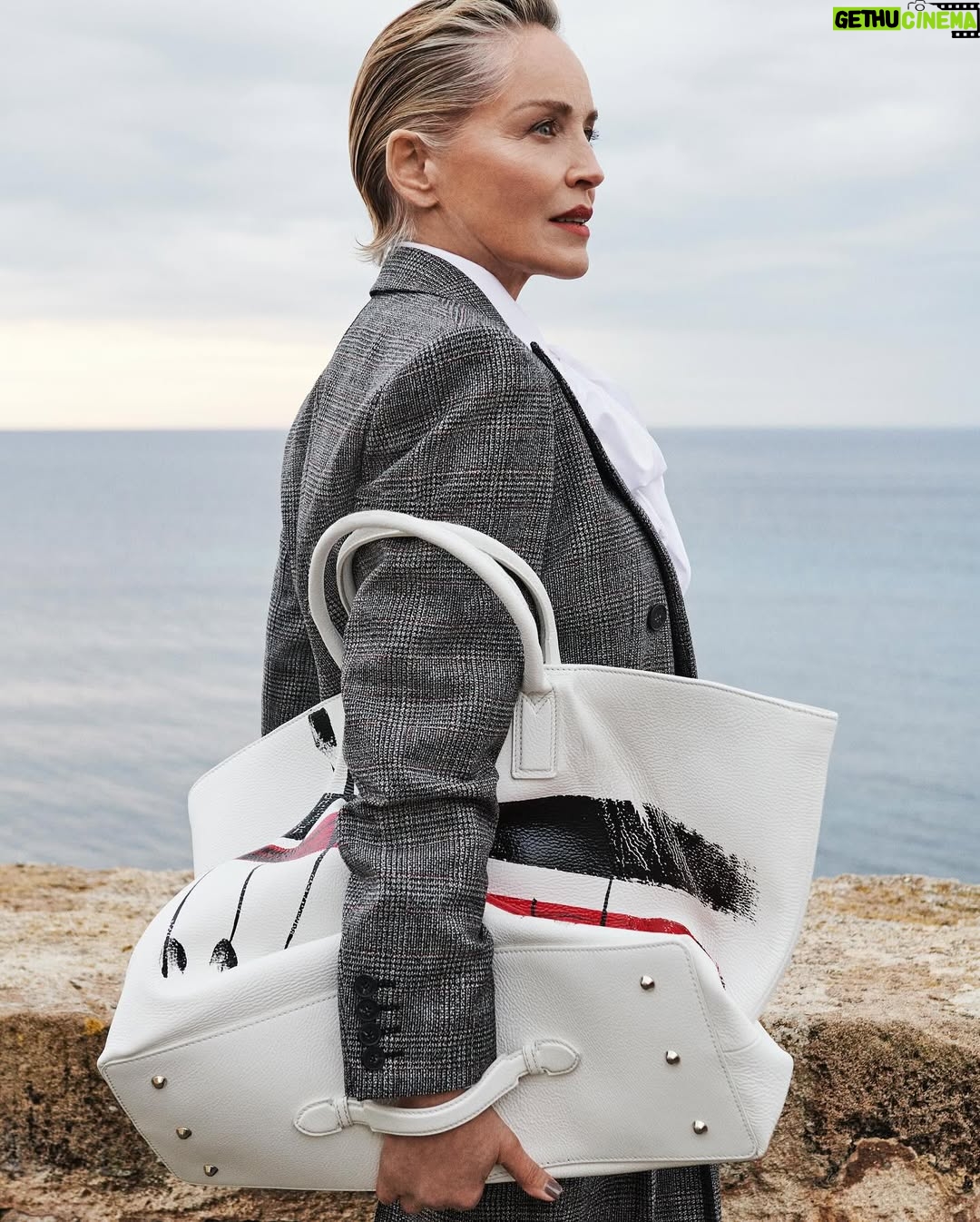 Sharon Stone - 35.6K Likes - A landscape suspended between sky and sea. Sharon Stone stars in the newest Antonio Marras Fall Winter 25 campaign, wearing a Prince of Wales tailored suit, paired with the painted Alma bag. Captured in Alghero, the hometown of Antonio Marras in Sardinia. @antoniomarrasofficial 
#SharonStone #AntonioMarras #adv #AMFallWinter25