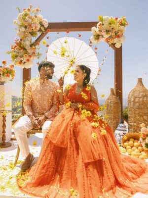 Sunaina Khera Instagram - A bride who made her mehendi truly her own. She chose our custom word lehenga in orange with a 3D floral blouse and designed just for her. This one is extra special for us too, as it’s the first time we brought personalized words to life in Hindi. Couldn’t have asked for a more beautiful beginning to this idea.✨🧡
Bride: @xxaishwaryaxx
Groom: devalgupta
Photographer: @theblemishedtales
Planner: @apanacheaffair
Florals: @tbdsandiego
HMU: @bridesbyroupak