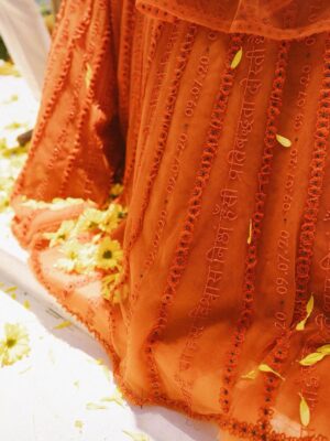 Sunaina Khera Instagram - A bride who made her mehendi truly her own. She chose our custom word lehenga in orange with a 3D floral blouse and designed just for her. This one is extra special for us too, as it’s the first time we brought personalized words to life in Hindi. Couldn’t have asked for a more beautiful beginning to this idea.✨🧡
Bride: @xxaishwaryaxx
Groom: devalgupta
Photographer: @theblemishedtales
Planner: @apanacheaffair
Florals: @tbdsandiego
HMU: @bridesbyroupak