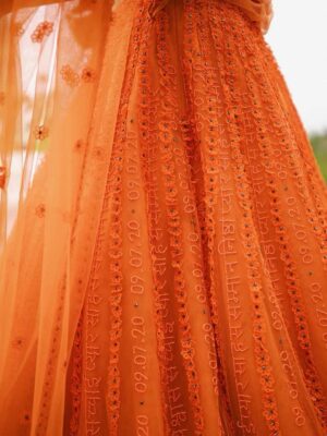 Sunaina Khera Instagram - A bride who made her mehendi truly her own. She chose our custom word lehenga in orange with a 3D floral blouse and designed just for her. This one is extra special for us too, as it’s the first time we brought personalized words to life in Hindi. Couldn’t have asked for a more beautiful beginning to this idea.✨🧡
Bride: @xxaishwaryaxx
Groom: devalgupta
Photographer: @theblemishedtales
Planner: @apanacheaffair
Florals: @tbdsandiego
HMU: @bridesbyroupak