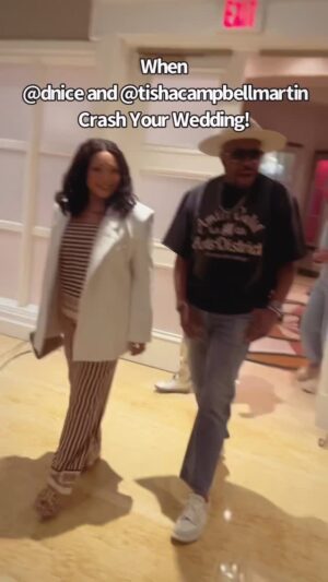 Tisha Campbell Instagram - We just saw a bunch of people and started following the crowd until we came to this beautiful couple celebrating with their family, the beginning of their lives together! So @dnice and I wanted to congratulate them. Big S/O to the beautiful couple @gollieimgully @bjsantana_
Bride and groom.