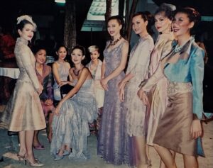 Cindy Sirinya Bishop Instagram - It has been the honor of my lifetime to have served Her Majesty Queen Sirikit, The Queen Mother — a woman of unparalleled grace, vision, and devotion to her people. 

Her Majesty’s love for Thai silk not only revived a treasured national art form but also restored livelihoods, pride, and purpose to thousands of Thai families across the country. In 1976, she established the SUPPORT Foundation to provide supplementary occupations for farmers facing unstable incomes due to changing rainfall and climate conditions. By encouraging traditional craftsmanship and local wisdom, she  helped transform humble village weaving into a globally celebrated craft ~ instilling hope in communities that continue to thrive to this day.

One of my fondest memories was modeling the exquisite creations of Thailand’s top designers for Her Majesty’s fashion showcases. I’ll never forget walking the runway outdoors, where the very villagers who wove the silk I was wearing watched with pride and delight. It was a beautiful full-circle moment to witness their craftsmanship being celebrated on a stage that honored them in return.

Her Majesty’s elegance, compassion, and radiant smile touched the hearts of everyone who had the privilege to be in her presence. Her legacy continues to shine in every thread of Thai silk — a symbol of artistry, resilience, and love for our people and culture. 💙

#QueenSirikit #ThaiSilk #LegacyOfLove #ThaiCraftsmanship #PrideOfThailand #CulturalHeritage
