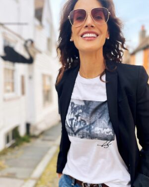 Jennifer Beals Instagram - Once upon a time, I made a T-shirt from a photograph I took. The origin story of the image is dear to my heart. Riding in a car on the way to an L Word premiere @Ilenechaiken told me yet another hardship that Bette and Tina would have to go through. I drew the image in the window condensation almost as a prayer to keep Bette and Tina together. I photographed the image as a remembrancer. 

TWENTY years later I made the image into a tshirt because I needed a black-and-white T-shirt to put under a blazer, but when some of you saw it, you made it clear to me that you wanted it, too. I realized how quickly a community can coalesce over a simple object that expresses love. By popular demand, I am bringing this super soft T-shirt back.

I’m so excited to share this collection with you, created in collaboration with @shopstands and crafted with so much heart. Whether you’re grabbing the beloved tee, hat, or bag for yourself or gifting them to someone you love, I hope you feel the intention in every piece. Thank you for continuing on this wild, crazy-ass journey with me. I can’t wait to see how you wear them. 💫 Link in my profile!

#thelword