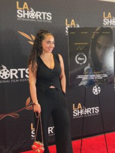 Anousha Instagram - .🎥🎬🎞️
Our film premiered at LA Shorts after nearly two years of dreaming, filming, and bringing it to life. To anyone in the film industry: this process takes time. It’s rarely easy, but storytelling is sacred. Since the beginning of humanity, stories have helped us make sense of life. They give us hope, remind us we’re not alone, and inspire us to keep going.
Your story matters. There’s space for it. This world is abundant, we need more voices, more visions, more truth.
Thank you to the cast and crew for creating such a safe, beautiful space for us to be vulnerable. Playing Mina was an honor. She’s fierce, raw, and deeply rooted in justice, and I carry her with me still.
To our brilliant director, @sahar_ghorishi.x ,thank you for pouring your soul into this. The silence in the theater, the tears in the room, you created that. And to my family and my partner: thank you for believing in me, always.
______________________________________________
فیلم ما بعد از نزدیک به دو سال تلاش، فیلم‌برداری و ساخت، در جشنواره‌ی LA Shorts اکران شد.
برای همه‌ی عزیزانی که در صنعت فیلم فعالیت می‌کنن: این مسیر، زمان‌بره و آسون نیست، اما قصه‌گویی یک کار مقدسه. از آغاز تاریخ بشر، داستان‌ها بودن که به زندگی‌مون معنا دادن. امید بخشیدن، ما رو به هم نزدیک کردن، و باعث شدن ادامه بدیم.
داستان تو مهمه. برای صدا و روایت تو جا هست. این دنیا پر از فراوانیه، ما به صداهای تازه، نگاه‌های نو و حقیقت‌های بیشتر نیاز داریم.
ممنونم از تیم تهيه كننده و عوامل که محیطی امن و زیبا برای حضور مخصوصاً بازیگران ساختن. نقش «مینا» برای من افتخاری بزرگ بود، دختری قوی، واقعی و ریشه‌دار در عدالت که هنوز در وجود من زندگی می‌کنه.
و به کارگردان بی‌نظیرمون، سحر عزیز، ممنونم که تمام قلب و روحت رو پای این فیلم گذاشتی. سکوت سالن، اشک تماشاگرها… همه از لحظه‌هایی بود که تو خلق کردی.
و در آخر، ممنونم از خانواده‌ام , پارتنرم و دوستانم که همیشه به من ایمان داشتن 🫂❤️