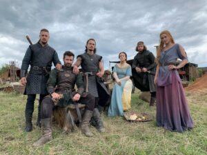 Eliza Butterworth Instagram - The 10 year anniversary of The Last Kingdom!!! ♥️⚔️♥️ Without a doubt this will forever be one of the most joyous, magnificent, magical and absolutely life changing chapters of my existence!! Any of our cast and crew can attest to this and we are connected forever through this beautiful show which was made over 8 years! The best job I will ever have! This show brought me the bestest friends anyone could dream of, the most stunning memories as well as an unbelievable education from all of the exquisite cast and crew in all things acting, filming and production. These people are magic and these photos and videos do no justice to show the years of fun and laughter we had together filming in beautiful Budapest! I started the show at age 21 and ended age 28 as a royal Saxon grandmother having the time of her life! This show allowed all of us actors to expand our range and they believed in us to carry such amazing storylines and relationships which blows my mind! Our crew and production team were exquisite in every way possible and brought every single second of this show to life! And the best part of all of these years of fun is getting to connect with our stunning fans who joined us for the epic ride and made it all possible! We love you so much! Thank you or everything!!! DESTINY IS ALL ♥️🥹♥️
