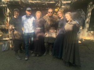 Eliza Butterworth Instagram - The 10 year anniversary of The Last Kingdom!!! ♥️⚔️♥️ Without a doubt this will forever be one of the most joyous, magnificent, magical and absolutely life changing chapters of my existence!! Any of our cast and crew can attest to this and we are connected forever through this beautiful show which was made over 8 years! The best job I will ever have! This show brought me the bestest friends anyone could dream of, the most stunning memories as well as an unbelievable education from all of the exquisite cast and crew in all things acting, filming and production. These people are magic and these photos and videos do no justice to show the years of fun and laughter we had together filming in beautiful Budapest! I started the show at age 21 and ended age 28 as a royal Saxon grandmother having the time of her life! This show allowed all of us actors to expand our range and they believed in us to carry such amazing storylines and relationships which blows my mind! Our crew and production team were exquisite in every way possible and brought every single second of this show to life! And the best part of all of these years of fun is getting to connect with our stunning fans who joined us for the epic ride and made it all possible! We love you so much! Thank you or everything!!! DESTINY IS ALL ♥️🥹♥️