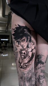 Gina Klein Instagram - All hail the amazing @ooqza !!! I got Zagreus tattooed on my thigh because why WOULDN'T I!? Enjoy this ASMR mini-vlog of the process start to finish ~ 

#ooqza #tattoo #animetattoo #gamertattoo #hadesgame #hades #zagreus #zagreustattoo #hadestattoo #tattoovlog #tattooasmr #ASMR