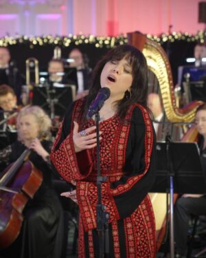 Imelda May Instagram - What an incredible experience to sing with @rteconcertorchestra, to be introduced by the loveliest man @martywhelanofficial and what an honour to be a part of such a beautiful night with @banatalquds The Daughters of Jerusalem who sing with such grace, talent, emotion, pride and stoicism.

Christmas is a time of great joy but then often great sadness as we reflect and miss those not with us to share those joys. 

I must admit I found it hard singing this beautiful song as I thought of all the people suffering in Palestine but also of my own mother and father who I miss greatly. 

But then I remember how much they both loved this time of year and all the gorgeous times we had together. 
How proud they’d be and how much they loved this song ‘A Cradle In Bethlehem’ the first time I recorded it.

So, full of love, I sang my heart out. 

I wish you all peace, love, warmth and finding huge joy in small and special moments. 

Nollaig Shona Daoibh

Imelda x

Dress: @tatreezsisters

Christmas in Kilmainham airs on Christmas Eve at 6.20pm on RTÉ ONE, on Lyric FM at 21.00 the same evening, and repeated at 7.10am on Christmas morning on RTÉ ONE.