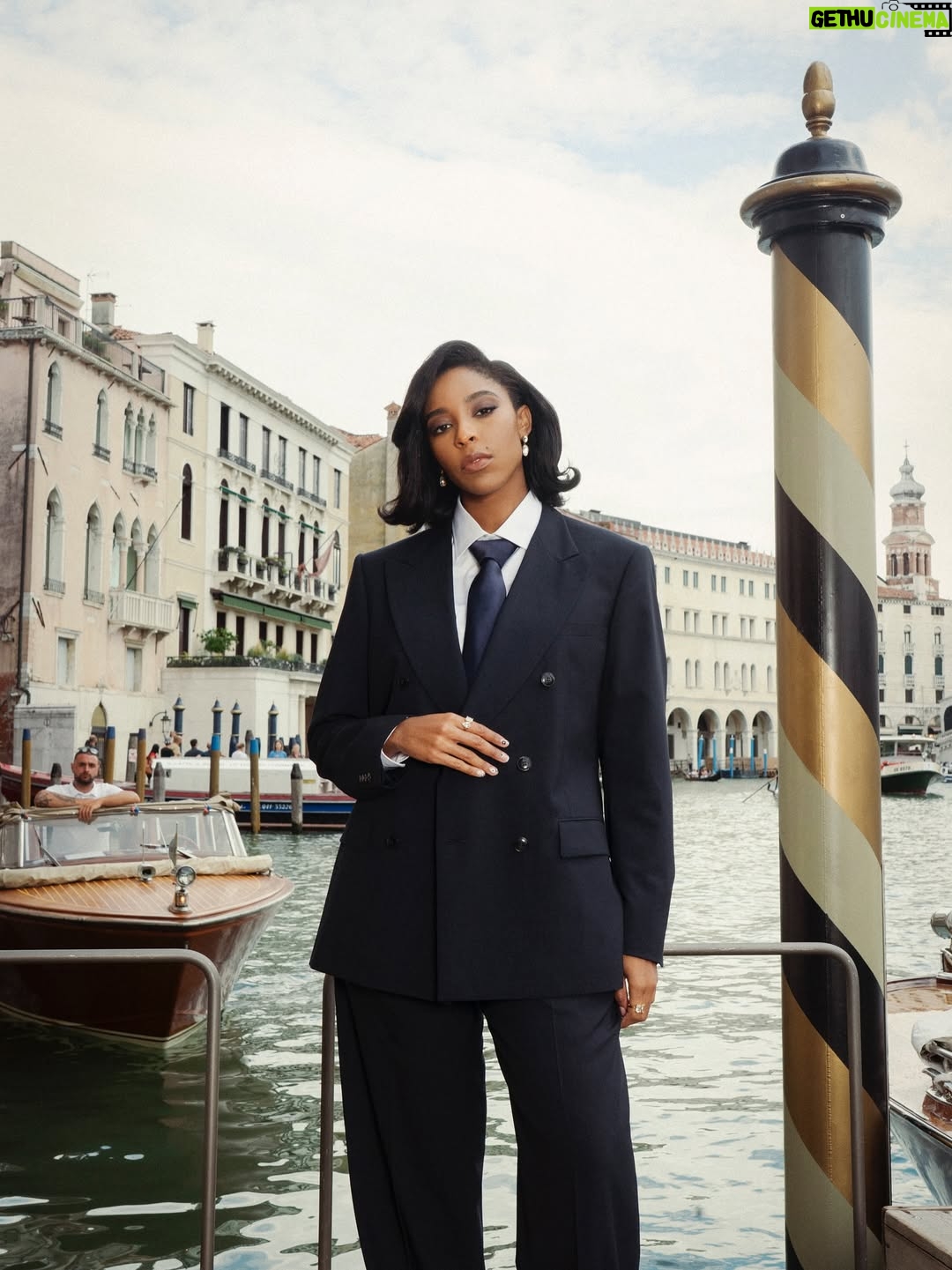 Jessica Williams - 18.9K Likes - Thank you @giorgioarmani for the Bond suit of my dreams. And THANK YOU  @armanibeauty for the gorgeous glammmmm and a trip to Venice for the Frankenstein premiere. #venezia82 #armanibeautypartner 

Photographer// @cibellelevi 
Suit// @giorgioarmani 
Makeup// @kennethsohmakeup 
Hair// @jamescatalanohair 
Stylist// @sarahslutsky 
Stylist assistants// @miacstella @carlee___ @allieraye_k