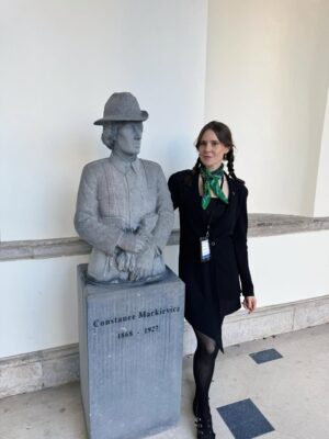 Kate Nash Instagram - Here I am with Constance Markievicz the Irish revolutionary nationalist politician, suffragist and socialist & the first woman elected to the Parliament of the United Kingdom, (although she was in prison at the time, what a legend) ☘️ Thank you @padalytd for inviting me to parliament, Leinster House in Dublin, it was truly inspiring. Thanks to @susanoneillmusic & @mickflannerymusic for having me & @boomvision at Vicar Street! To @rionhannora for the visionary garms, to @trawfawdeen for jumping in last minute & playing the fiddle like an absolute angel, to @cobblestonepubdublin & the Mulligans for the session & inviting me up for a tune. And as always to @cornucopia_restaurant for the many vegan scones that I enjoy so much. Happy Christmas everyone. 💚☘️