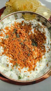 Laura Vitale Instagram - Listen I loveeeeeeeeeeeee me a dill pickle and I LIVEEEE for dips and snacks in the summertime and this fried pickle dip is quite possibly one of the most delicious things ever!! Recipe below, you just MUST!! 

Dip: 
3/4 cup of sour cream 
3/4 cup of Mayo 
3/4 of finely chopped dill pickles 
4 Scallions, finely chopped 
1 clove of garlic, grated
2 tbsp of chopped dill
2 tbsp of chopped parsley 
Salt to taste 

For the crispy topping: 
2 tbsp of olive oil
1/2 cup of panko breadcrumbs 

Just cook them long enough for the panko to turn a golden brown color then let cool before adding to your dip. You must serve this with ruffles , it’s like the law I swear!