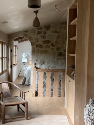 Lauren Liess Instagram - Full video House Tour of the Upstairs at our place is up! 🤍  from the stone walls to the cross cut-out to the stair railings to Narnia… each of the kids had their own ideas (the boys skewed Medieval & the girls asked for “old-fashioned”   the guest bedroom was made from leftovers) (1st image of the “folk lamp” from my collection with @troylighting / photo by @helennorman … 4th slide I am SO excited about the new “voyage” bed from my collection with @woodbridgefurniture )
