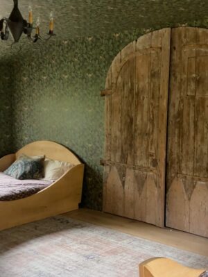 Lauren Liess Instagram - Full video House Tour of the Upstairs at our place is up! 🤍  from the stone walls to the cross cut-out to the stair railings to Narnia… each of the kids had their own ideas (the boys skewed Medieval & the girls asked for “old-fashioned”   the guest bedroom was made from leftovers) (1st image of the “folk lamp” from my collection with @troylighting / photo by @helennorman … 4th slide I am SO excited about the new “voyage” bed from my collection with @woodbridgefurniture )