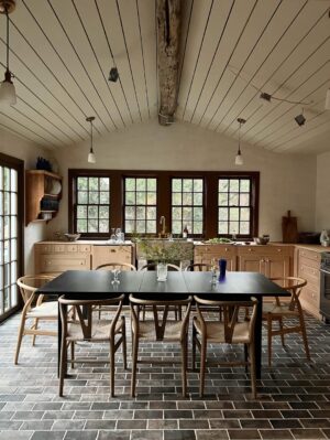Lauren Liess Instagram - The “Whalerman’s Watch” beach cottage is almost finished just in time for the holidays! 🐳 So thankful for this chill time with the family. Sending love to you and yours this Thanksgiving! 

The design details: 
Leftover beams from the Meadow give the place those old scrap wood Outer Banks vibes with a little bit o’ those old English Lost Colony Roots. The original houses around here were made from leftover scrap wood from barns, shipwrecks etc. Still working on things like installing countertops and lighting.

Stucco walls, planked board ceilings, painted old floorboards mixed with brick and some existing furnishings (the ikea table came with the house & we had most everything in our barn!) and a couple of new pieces (the Meadow sofa from my collection with @taylorkingfurniture   an antique Swedish 1872-painted chest) have made this place into a relaxed, cozy, and flop-able beach pad. Loving it in the off-season with candles, kids and pups.  The whole renovation is featured in our “Saving Lost Cottages of the Outer Banks” video series. 🤍🌊